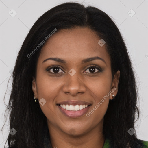 Joyful black young-adult female with long  brown hair and brown eyes