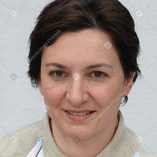 Joyful white adult female with short  brown hair and brown eyes