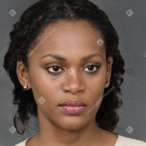 Neutral black young-adult female with medium  brown hair and brown eyes