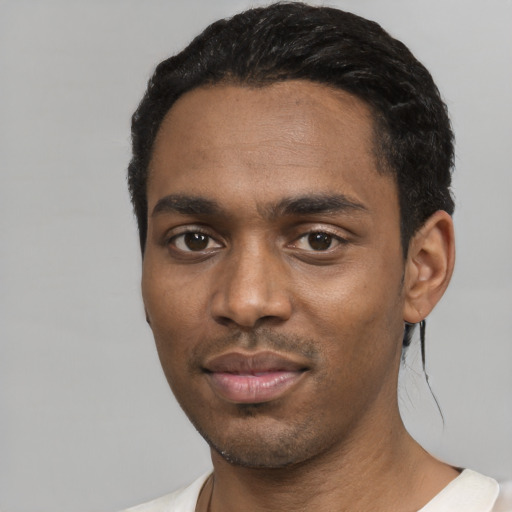 Neutral black young-adult male with short  black hair and brown eyes