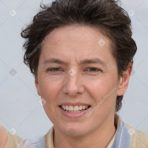 Joyful white adult female with short  brown hair and brown eyes