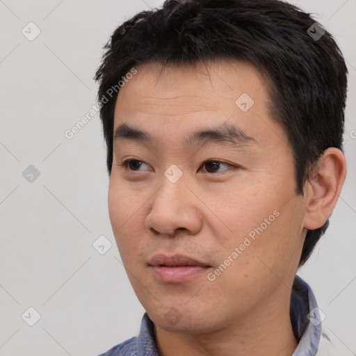 Neutral asian young-adult male with short  black hair and brown eyes