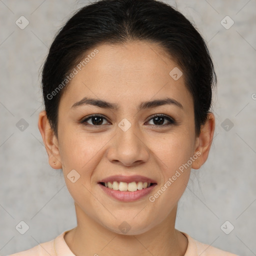 Joyful latino young-adult female with short  brown hair and brown eyes