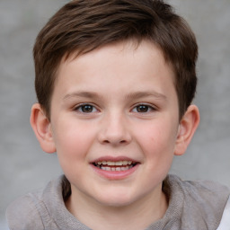 Joyful white child male with short  brown hair and brown eyes