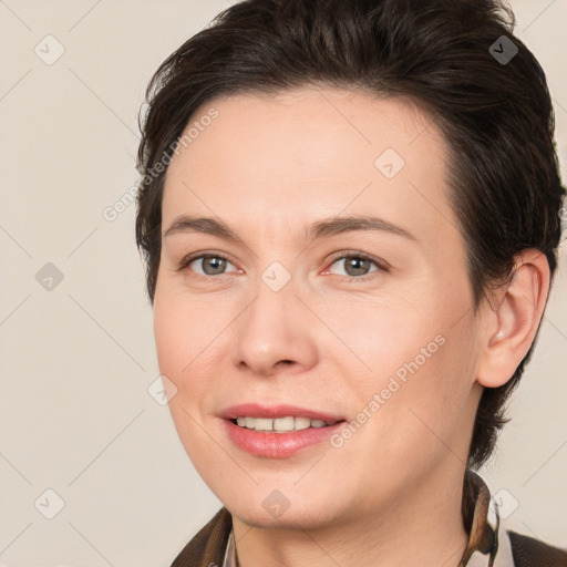 Joyful white young-adult female with medium  brown hair and brown eyes