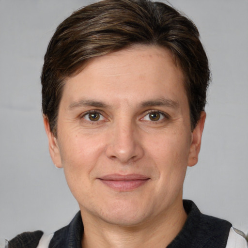 Joyful white adult male with short  brown hair and grey eyes