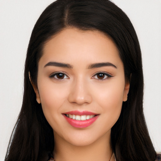 Joyful latino young-adult female with long  brown hair and brown eyes