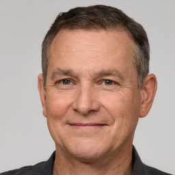 Joyful white middle-aged male with short  brown hair and brown eyes