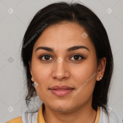 Joyful latino young-adult female with medium  brown hair and brown eyes