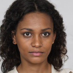 Neutral black young-adult female with medium  brown hair and brown eyes