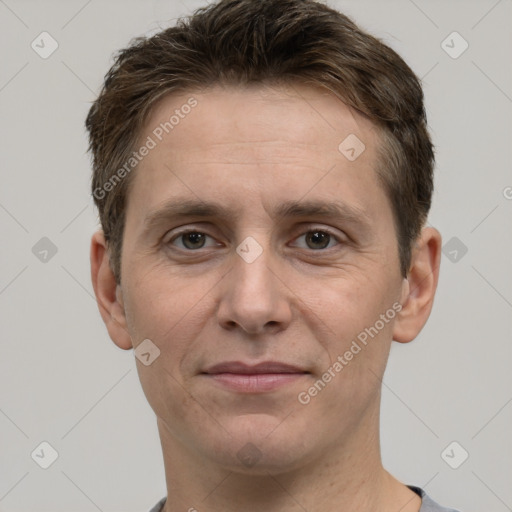 Joyful white adult male with short  brown hair and grey eyes