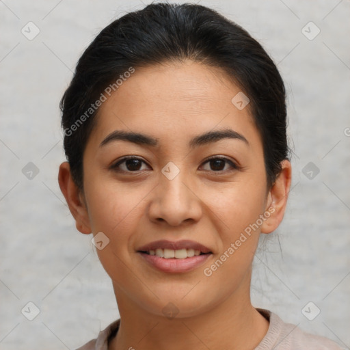 Joyful latino young-adult female with short  brown hair and brown eyes