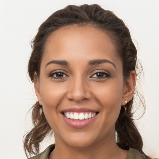 Joyful white young-adult female with long  brown hair and brown eyes