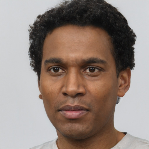 Neutral latino adult male with short  black hair and brown eyes