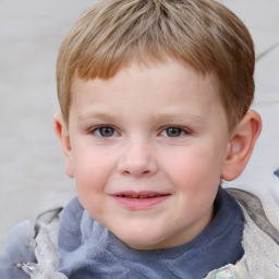 Joyful white child male with short  brown hair and grey eyes