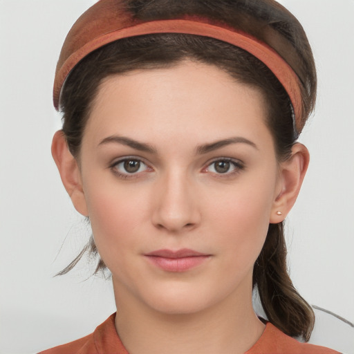 Neutral white young-adult female with medium  brown hair and brown eyes