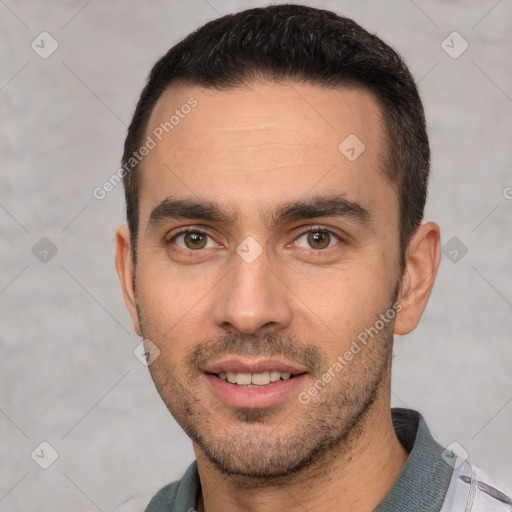 Joyful white young-adult male with short  brown hair and brown eyes