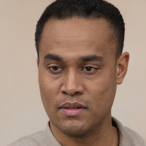 Neutral black young-adult male with short  black hair and brown eyes