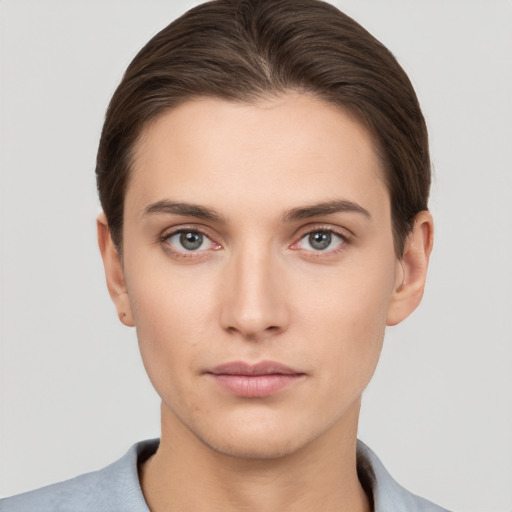 Neutral white young-adult female with short  brown hair and brown eyes