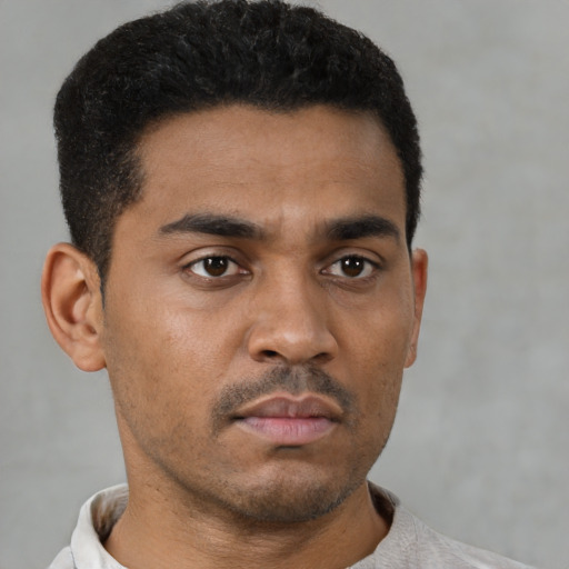 Neutral latino young-adult male with short  black hair and brown eyes