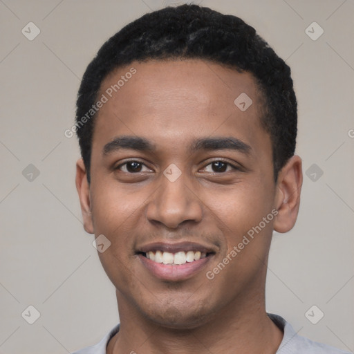 Joyful black young-adult male with short  black hair and brown eyes