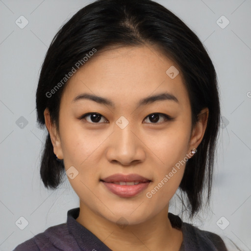 Joyful asian young-adult female with medium  black hair and brown eyes