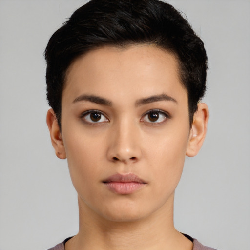 Neutral white young-adult female with short  black hair and brown eyes