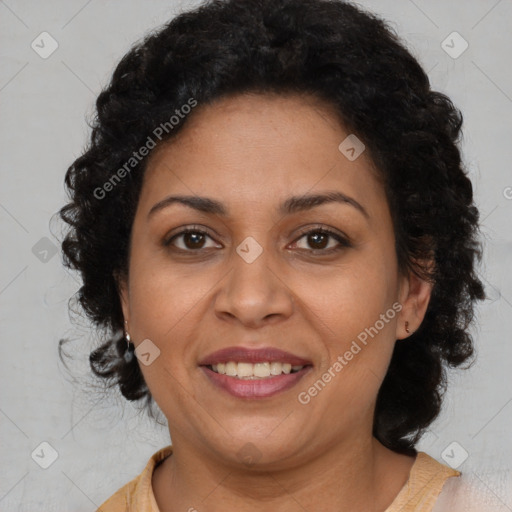 Joyful latino adult female with medium  brown hair and brown eyes