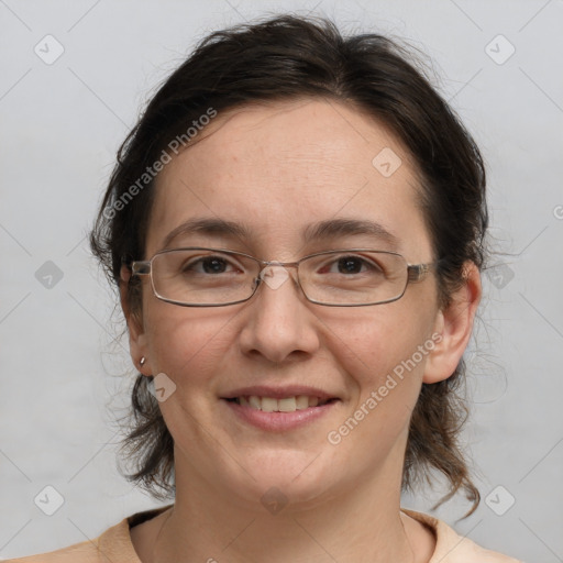 Joyful white adult female with medium  brown hair and grey eyes