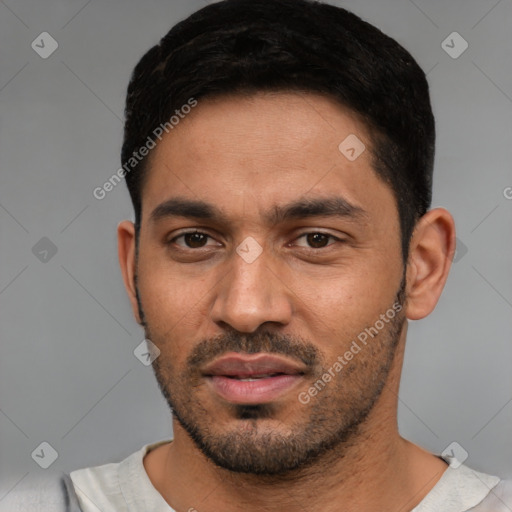 Joyful white young-adult male with short  black hair and brown eyes