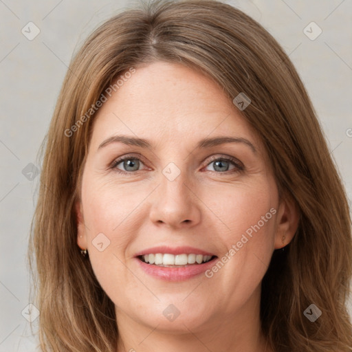 Joyful white young-adult female with long  brown hair and green eyes