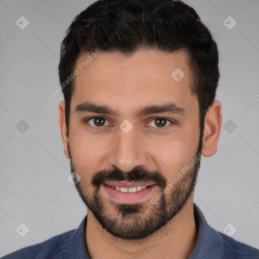 Joyful white young-adult male with short  black hair and brown eyes