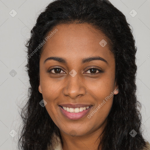 Joyful black young-adult female with long  black hair and brown eyes