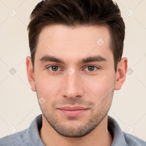 Neutral white young-adult male with short  brown hair and brown eyes