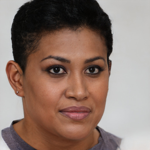 Joyful latino young-adult female with short  brown hair and brown eyes