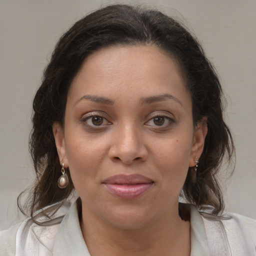 Joyful white young-adult female with medium  brown hair and brown eyes