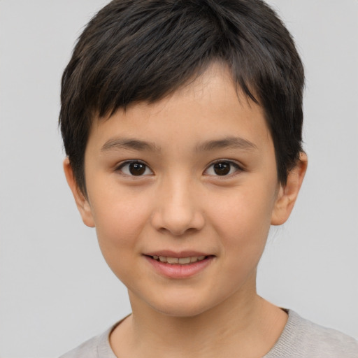 Joyful white child female with short  brown hair and brown eyes