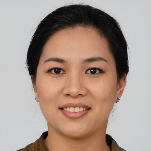 Joyful asian young-adult female with medium  black hair and brown eyes