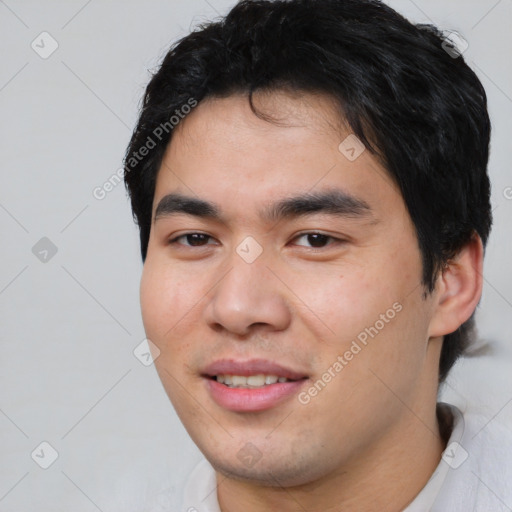 Joyful asian young-adult male with short  black hair and brown eyes