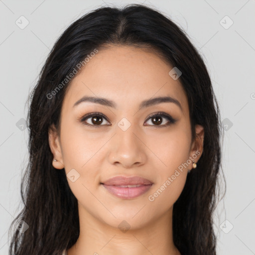 Joyful latino young-adult female with long  brown hair and brown eyes