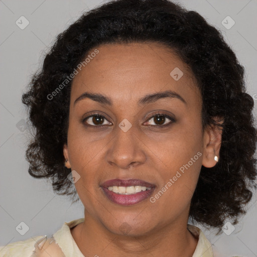 Joyful black young-adult female with medium  brown hair and brown eyes