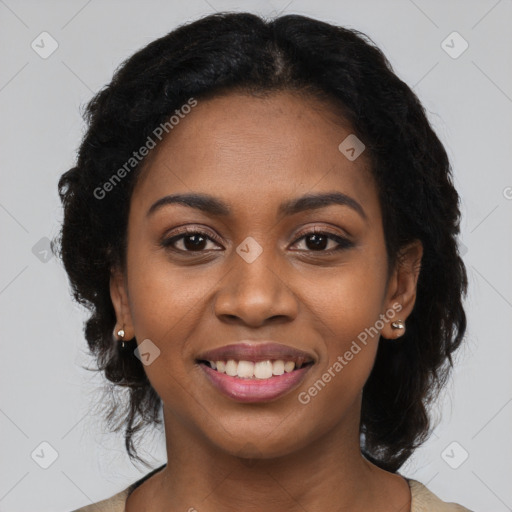 Joyful black young-adult female with long  black hair and brown eyes