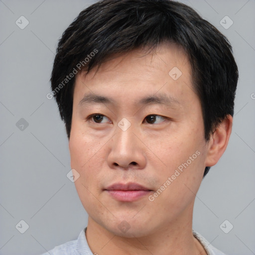 Neutral asian young-adult male with short  brown hair and brown eyes