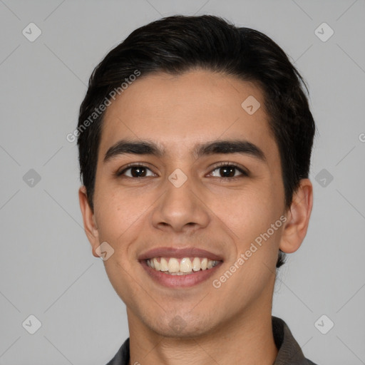 Joyful white young-adult male with short  black hair and brown eyes