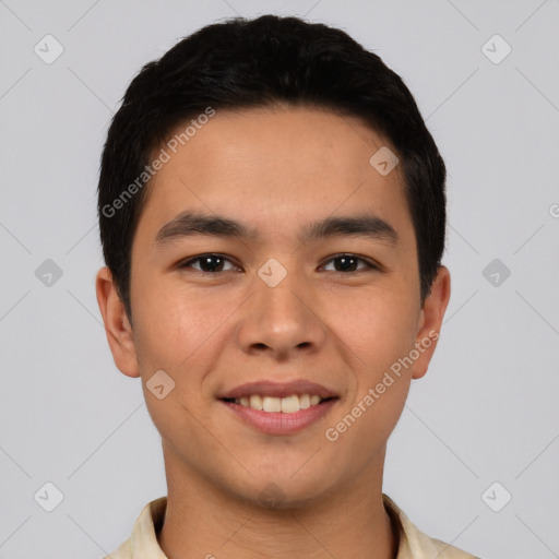 Joyful white young-adult male with short  black hair and brown eyes