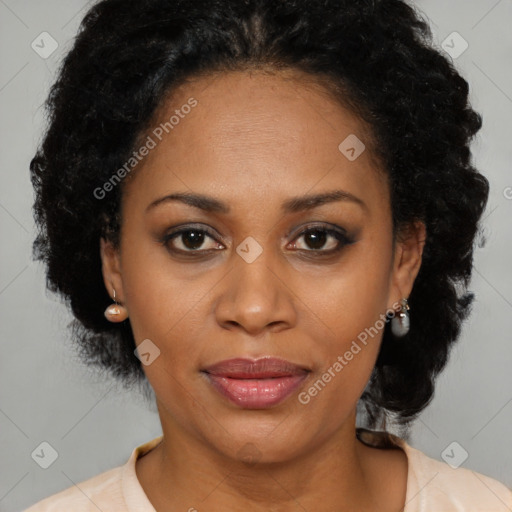 Joyful black adult female with short  brown hair and brown eyes