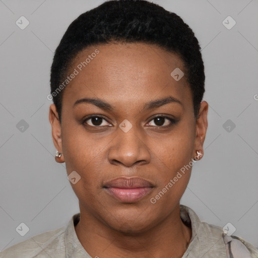 Joyful black young-adult female with short  black hair and brown eyes