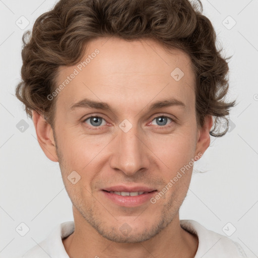 Joyful white adult male with short  brown hair and grey eyes