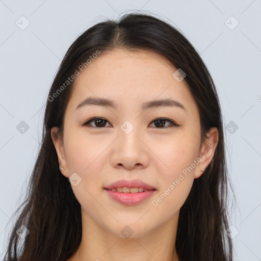 Joyful asian young-adult female with long  brown hair and brown eyes