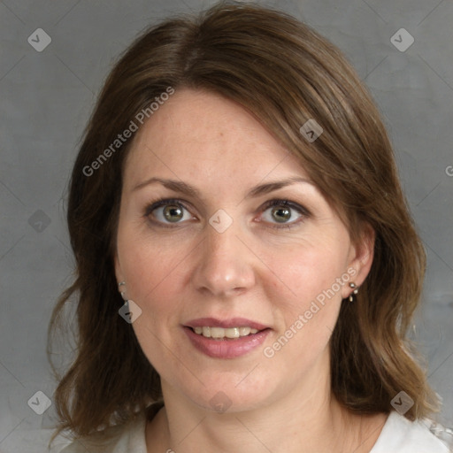 Joyful white adult female with medium  brown hair and grey eyes